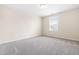 Carpeted bedroom with neutral walls and a window providing natural light at 1104 Arden Trace Ct, Fuquay Varina, NC 27526