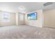 Large bonus room featuring neutral walls, plush carpet, and lots of natural light at 1104 Arden Trace Ct, Fuquay Varina, NC 27526