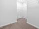 Walk-in closet featuring wire shelving and carpeted floors at 1104 Arden Trace Ct, Fuquay Varina, NC 27526