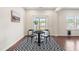 Cozy dining area with hardwood floors, modern decor, and plenty of natural light at 1104 Arden Trace Ct, Fuquay Varina, NC 27526