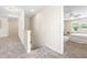 Upstairs hallway featuring carpet and access to the bedroom at 1104 Arden Trace Ct, Fuquay Varina, NC 27526