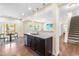 Modern kitchen with stainless steel sink, granite counters, and bar seating area at 1104 Arden Trace Ct, Fuquay Varina, NC 27526