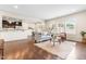 Open-concept living room features hardwood floors, neutral decor, and lots of natural light at 1104 Arden Trace Ct, Fuquay Varina, NC 27526