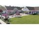 Outdoor community space featuring picnic tables, seating areas, lush landscaping, and a sociable atmosphere at 1105 Masters Place Way # 154, Durham, NC 27703