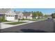 Neighborhood street view with sidewalks and manicured lawns, promoting a welcoming community atmosphere at 1105 Masters Place Way # 154, Durham, NC 27703
