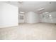 Bonus room featuring carpet, neutral walls, windows, and ceiling fan with lights at 11221 Paddy Hollow Ln, Raleigh, NC 27614