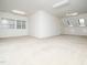 Bright bonus room featuring neutral carpeting, multiple windows, and a ceiling fan at 11221 Paddy Hollow Ln, Raleigh, NC 27614