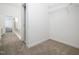 Walk-in closet featuring neutral walls, carpet, with access to an ensuite bathroom at 11221 Paddy Hollow Ln, Raleigh, NC 27614