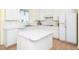 Bright kitchen boasting stainless appliances, white cabinets, and ample counter space at 11221 Paddy Hollow Ln, Raleigh, NC 27614