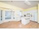 Spacious kitchen with hardwood floors, white cabinetry, and a central island at 11221 Paddy Hollow Ln, Raleigh, NC 27614