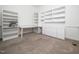 Bright office space featuring built-in bookshelves, ample storage, and a large desk area at 11221 Paddy Hollow Ln, Raleigh, NC 27614