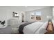 Bedroom featuring bright windows, stylish decor, and a plush bed with soft blankets at 1168 Solace Way, Rolesville, NC 27571