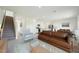 Inviting living room open to kitchen and dining area featuring modern decor and ample seating at 1168 Solace Way, Rolesville, NC 27571