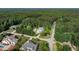 Beautiful aerial view of a home with lush landscaping and a sparkling pool nestled in a private, wooded neighborhood at 1201 Kalworth Rd, Wake Forest, NC 27587