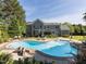 Spacious backyard with a large in-ground pool, lounge chairs, and lush landscaping for outdoor enjoyment at 1201 Kalworth Rd, Wake Forest, NC 27587