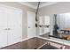 Exercise room features wood floors, exercise equipment, mirror, and access to storage via the double doors at 1201 Kalworth Rd, Wake Forest, NC 27587
