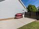 Exterior view of home with kayaks stored alongside privacy fence and walkway at 1201 Kalworth Rd, Wake Forest, NC 27587
