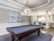 Entertain in style within the game room showcasing a pool table and elegant pendant lighting at 1201 Kalworth Rd, Wake Forest, NC 27587