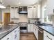 Beautiful kitchen featuring custom cabinetry, stainless steel appliances, granite countertops, and modern fixtures at 1201 Kalworth Rd, Wake Forest, NC 27587