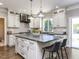 Gourmet kitchen with custom cabinets, an island with seating, granite countertops, and stainless steel appliances at 1201 Kalworth Rd, Wake Forest, NC 27587