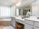 Luxurious main bathroom with double vanity, soaking tub, and elegant finishes at 1201 Kalworth Rd, Wake Forest, NC 27587
