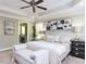 Bright main bedroom featuring a large bed, tasteful artwork, and ample natural light at 1201 Kalworth Rd, Wake Forest, NC 27587