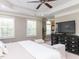 Serene main bedroom with a large window, a ceiling fan, and stylish furniture at 1201 Kalworth Rd, Wake Forest, NC 27587