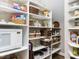 Well-organized pantry with ample shelving, baskets, and storage containers for convenient organization at 1201 Kalworth Rd, Wake Forest, NC 27587