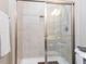 Modern shower features light tile, glass doors, and built in soap and shampoo niche for streamlined storage at 1201 Kalworth Rd, Wake Forest, NC 27587