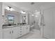 Modern bathroom featuring double vanity, spacious shower with seat, and stylish finishes at 125 Shadowdale Ln, Rolesville, NC 27571