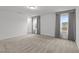Large bonus room boasts plush carpeting, ample natural light, and neutral color palette at 125 Shadowdale Ln, Rolesville, NC 27571