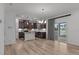 Open-concept kitchen with stainless appliances, a white island, and seamless access to the dining and living areas at 125 Shadowdale Ln, Rolesville, NC 27571