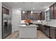 Stylish kitchen with stainless steel appliances, granite counters, and a central island at 125 Shadowdale Ln, Rolesville, NC 27571