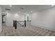 Carpeted loft area features a wrought iron railing and a view from the home's large window at 125 Shadowdale Ln, Rolesville, NC 27571