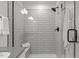 Spa-like shower with subway tile, built-in bench, and modern fixtures at 125 Shadowdale Ln, Rolesville, NC 27571