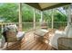 Inviting porch with comfortable seating and views of lush greenery, perfect for relaxing outdoors at 129 E Chestnut Ave, Wake Forest, NC 27587