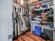 Spacious walk-in closet with ample storage space, shelving, and hardwood floors at 129 E Chestnut Ave, Wake Forest, NC 27587