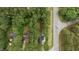 Aerial view of lush wooded property featuring a charming home near a quiet road at 14 Donnibrook, Fuquay Varina, NC 27526