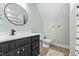 Bathroom showcasing a modern vanity and a toilet with a patterned shower curtain at 14 Donnibrook, Fuquay Varina, NC 27526