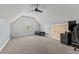 Carpeted bonus room with a ceiling fan and good natural light for your office setup at 14 Donnibrook, Fuquay Varina, NC 27526