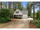Inviting curb appeal with a well-manicured lawn and a charming white cottage-style home at 14 Donnibrook, Fuquay Varina, NC 27526