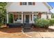 Charming front exterior featuring a cozy porch and manicured landscaping for added appeal at 14 Donnibrook, Fuquay Varina, NC 27526