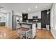 Stylish kitchen featuring stainless steel appliances, a central island, and open layout at 14 Donnibrook, Fuquay Varina, NC 27526