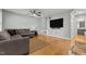 Spacious living room with hardwood floors, ideal for relaxation and entertaining guests at 14 Donnibrook, Fuquay Varina, NC 27526