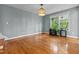 Bright living space with hardwood floors and natural light showcasing a warm ambiance at 14 Donnibrook, Fuquay Varina, NC 27526