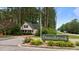 Charming white cottage-style home nestled in a quiet community near the Donnibrook entrance sign at 14 Donnibrook, Fuquay Varina, NC 27526