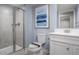 Clean bathroom featuring a glass shower, vanity, and toilet for your convenience at 1424 Rollman Farm Rd, Raleigh, NC 27603