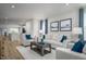 Spacious living room with comfortable seating, modern decor, and ample natural light at 1424 Rollman Farm Rd, Raleigh, NC 27603