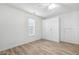 Bedroom features a window with lots of storage space, and wood-look flooring at 149 Hutson Ln, Clayton, NC 27527
