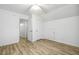 Bright bedroom with wood-look flooring, and access to closet or additional room at 149 Hutson Ln, Clayton, NC 27527